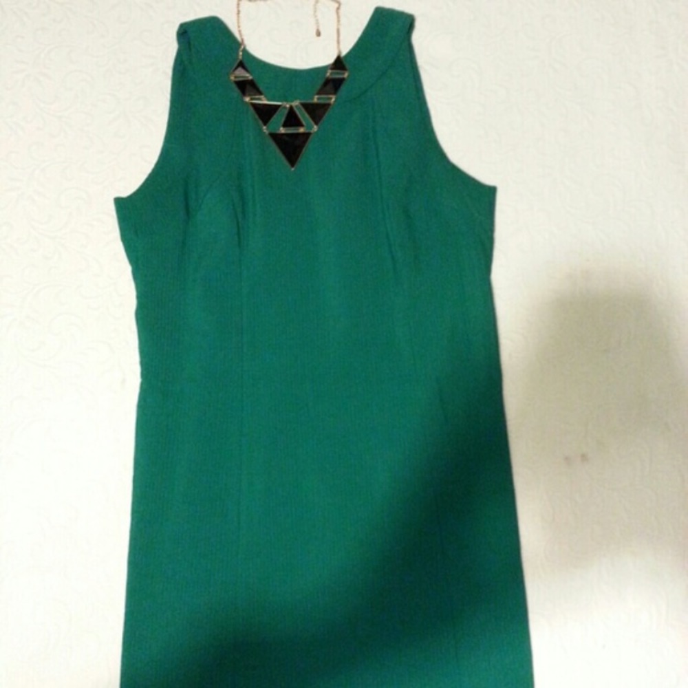 Green sleeveless dress.